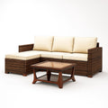Ensemble de canapé en résine tressée marron avec coussins en tissu beige et table basse en bois