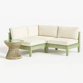 Ensemble de canapé d'angle extérieur en bois avec coussins crème et table en osier et verre